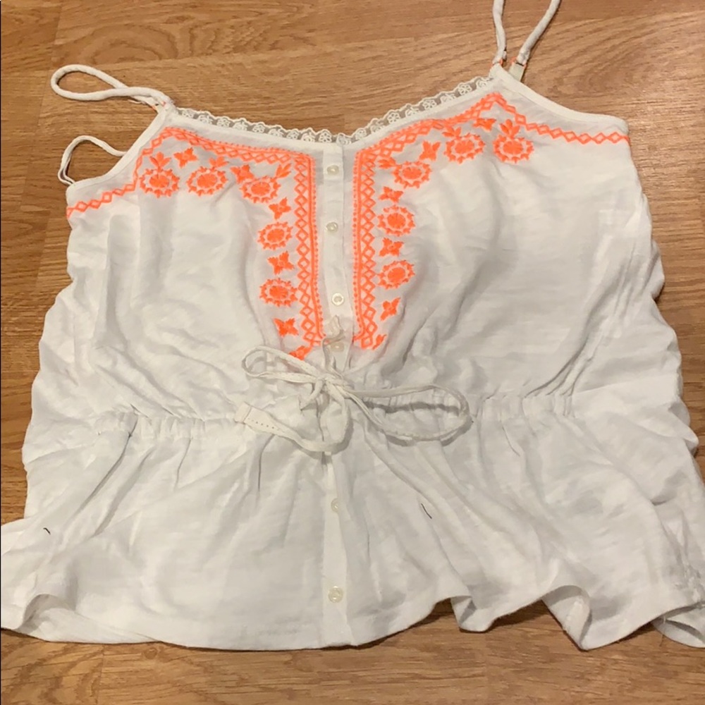 White tank with orange design